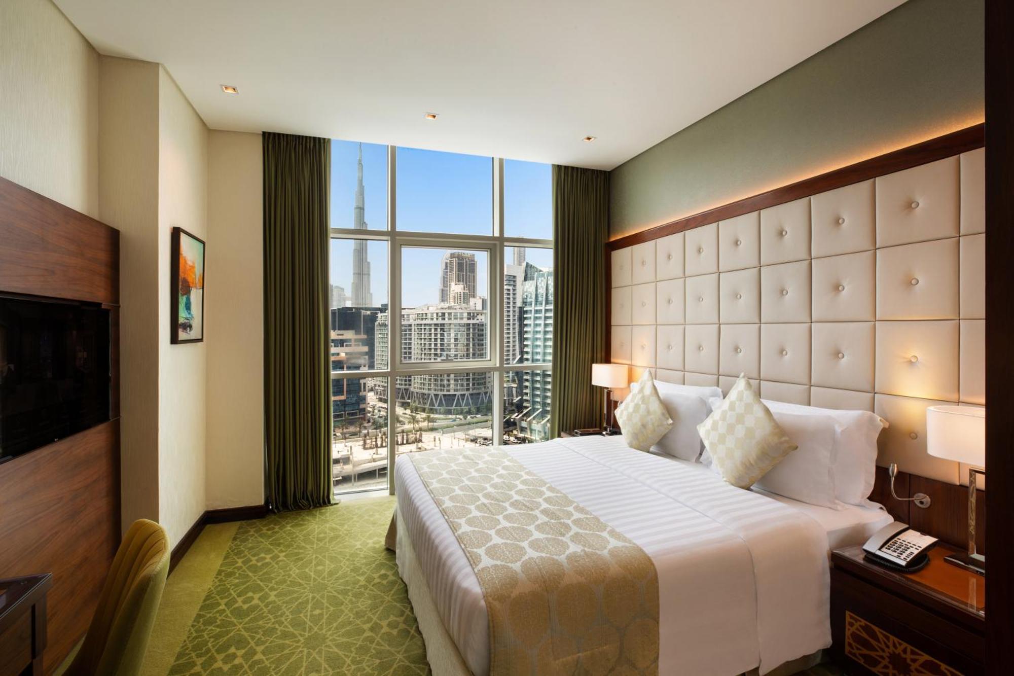 Royal Continental Suites Business Bay - Deluxe Apartments Dubaï Extérieur photo A bedroom at the hotel
